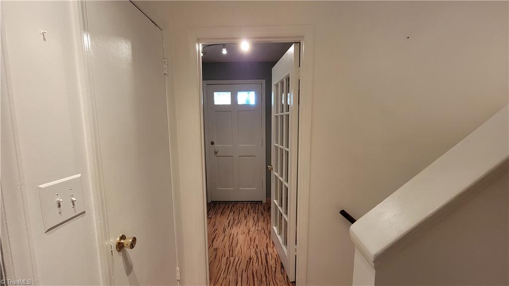 755 Irish Road Rural Hall, NC 27045 - Photo 13 of 32 As you leave the kitchen the front entrance is through the French door to your left with a coat closet. The stairway to the upper level and the lower level directly off the kitchen.