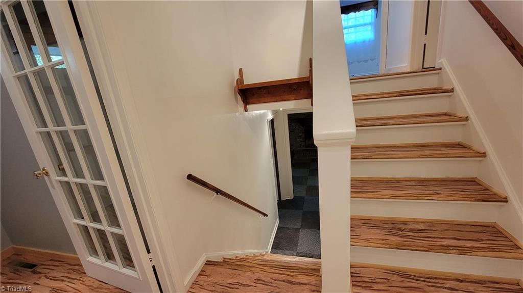 755 Irish Road Rural Hall, NC 27045 - Photo 14 of 32 Split level stairway to the upper and lower level.