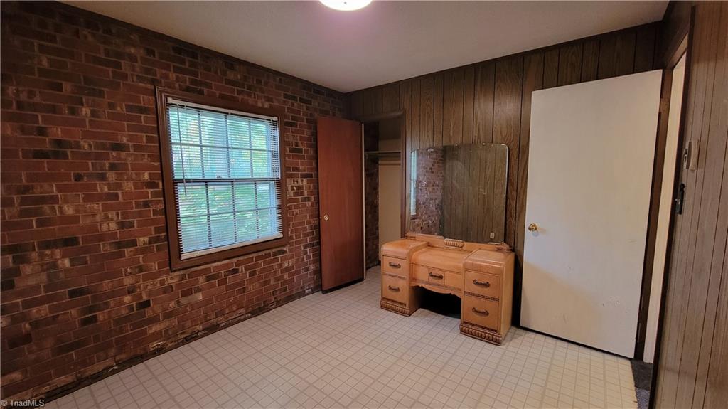 755 Irish Road Rural Hall, NC 27045 - Photo 23 of 32 The fourth bedroom space is to the left of the lower level stairs.