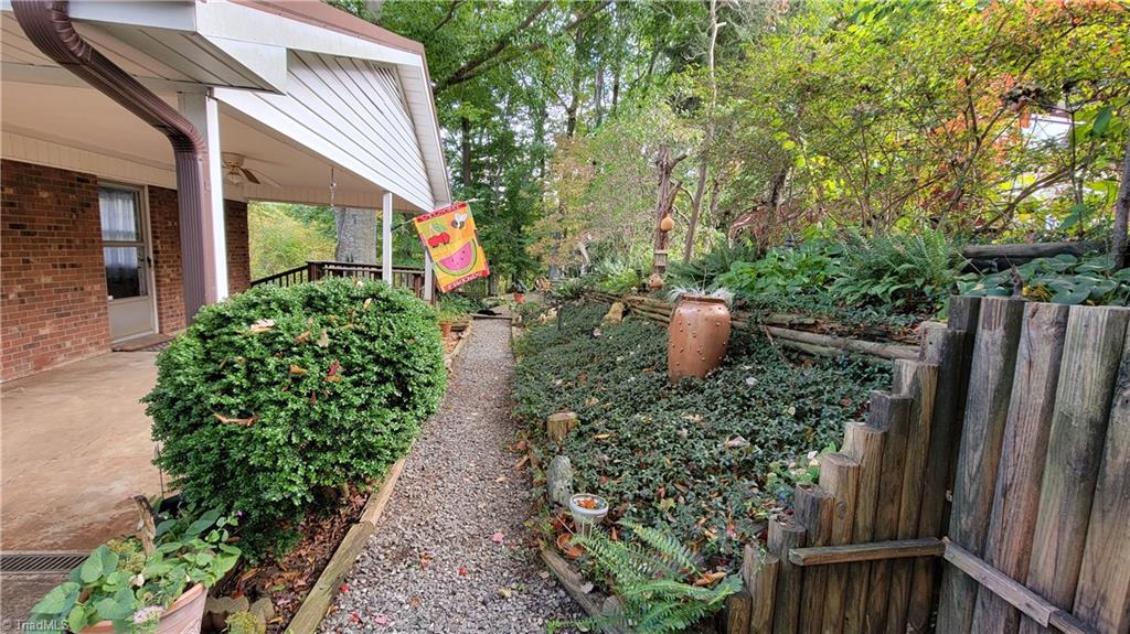 755 Irish Road Rural Hall, NC 27045 - Photo 27 of 32 Views to the right of the carport and to the backyard.