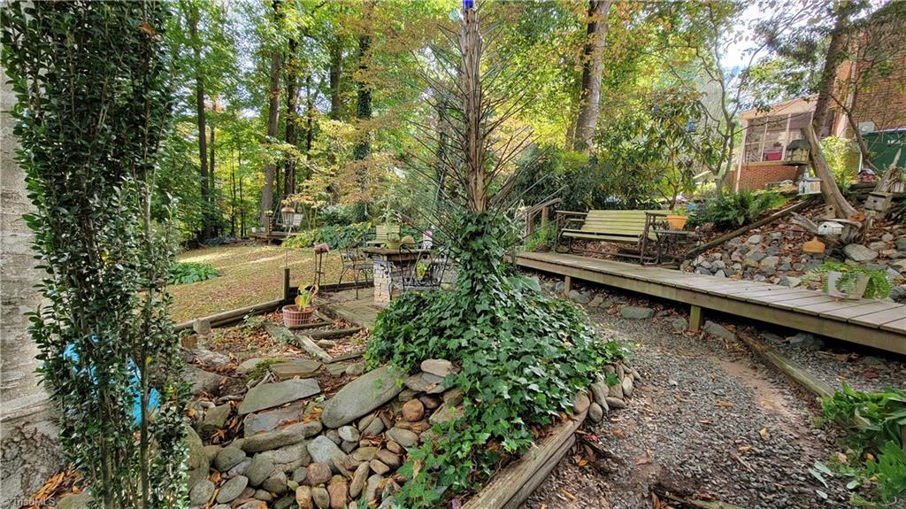 755 Irish Road Rural Hall, NC 27045 - Photo 28 of 32 Custom walkway and sitting areas perfect for entertaining.