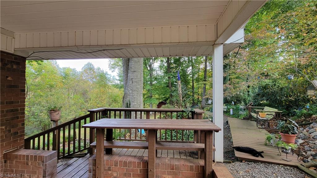 755 Irish Road Rural Hall, NC 27045 - Photo 29 of 32 Built in, covered bar top table at the back of the carport overlooking the back yard.