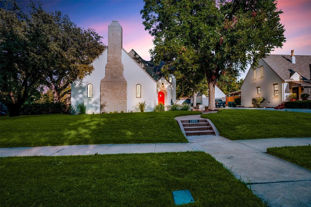 2809 6th Avenue Fort Worth, TX 76110 - Photo 1 of 38 a front view of a house with a garden