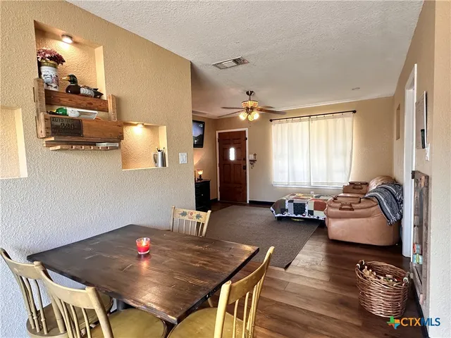 a kitchen with stainless steel appliances granite countertop a stove microwave and refrigerator