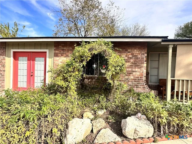 a bed room with a bed and a window