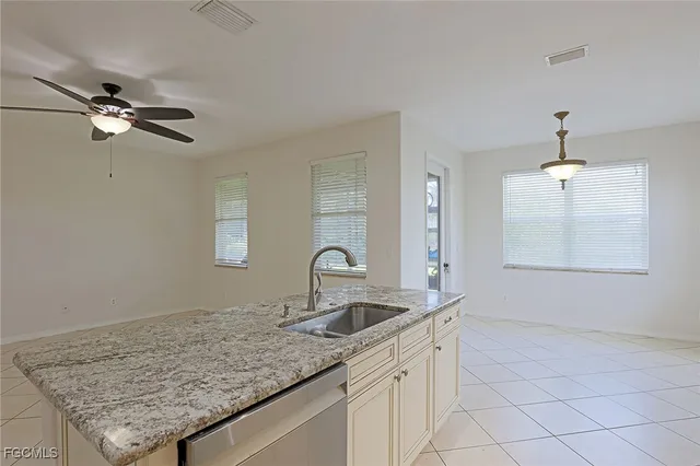 a kitchen with a sink and a window