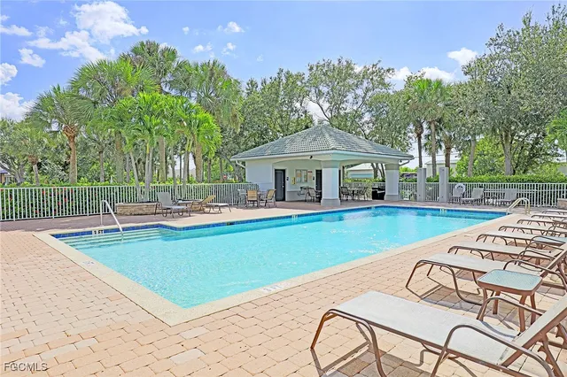 a view of a lake with houses in the back