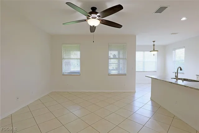 a view of a kitchen with a sink cabinets and appliances