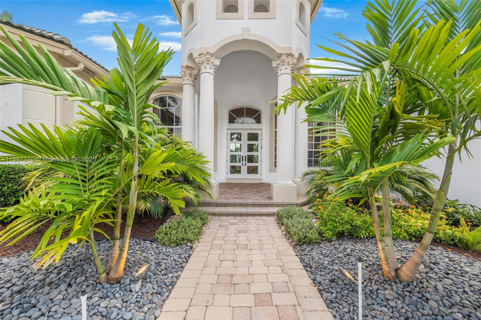 3250 West Stonebrook Circle Davie, FL 33330 - Photo 11 of 73 a front view of a house with garden