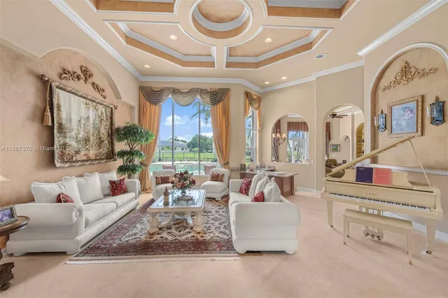 a view of a dining room with furniture and a chandelier