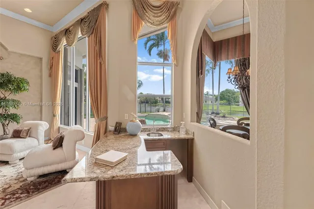 a living room with fireplace furniture and a table