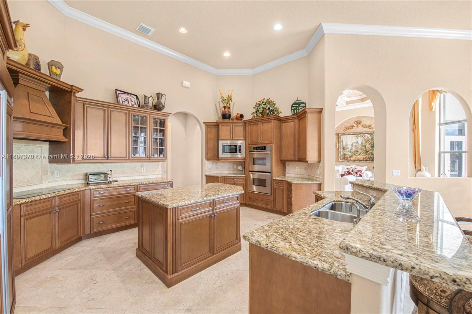 3250 West Stonebrook Circle Davie, FL 33330 - Photo 23 of 73 a kitchen with stainless steel appliances granite countertop a sink and cabinets