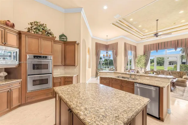 a bathroom with a granite countertop sink mirror vanity and toilet