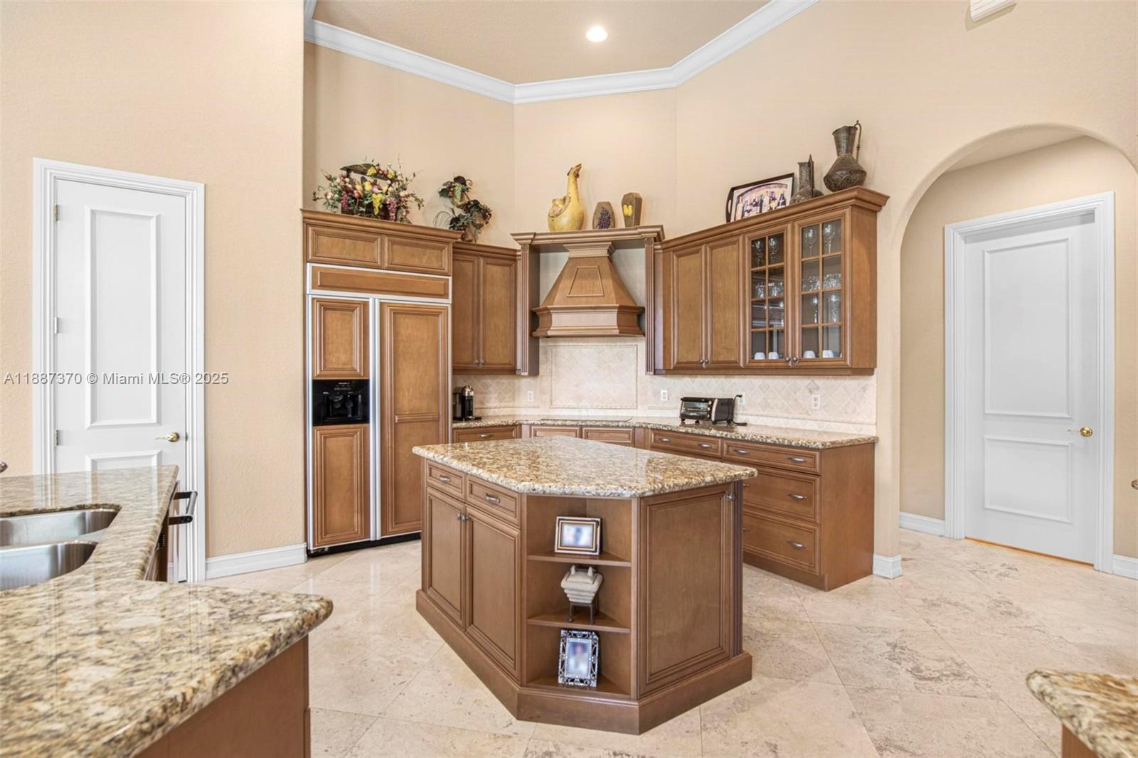 3250 West Stonebrook Circle Davie, FL 33330 - Photo 25 of 73 a kitchen with stainless steel appliances granite countertop a sink stove and refrigerator