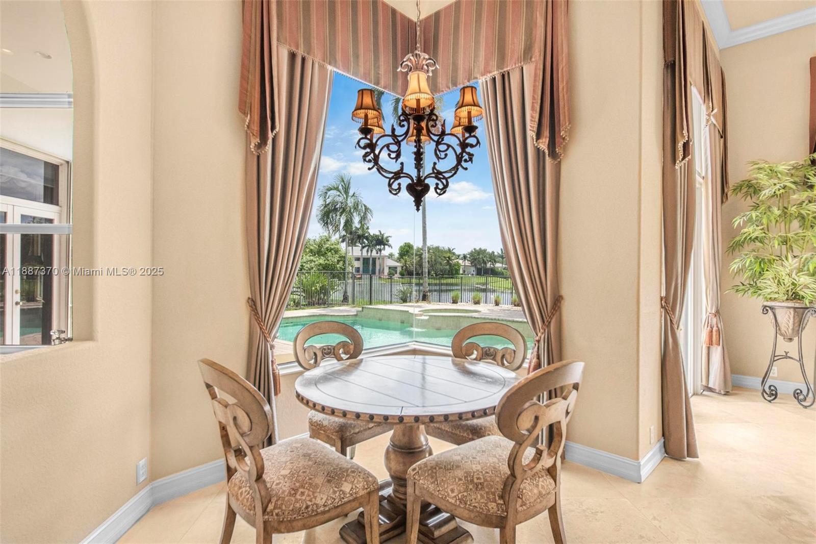 3250 West Stonebrook Circle Davie, FL 33330 - Photo 27 of 73 a view of a dining room with furniture window and outside view