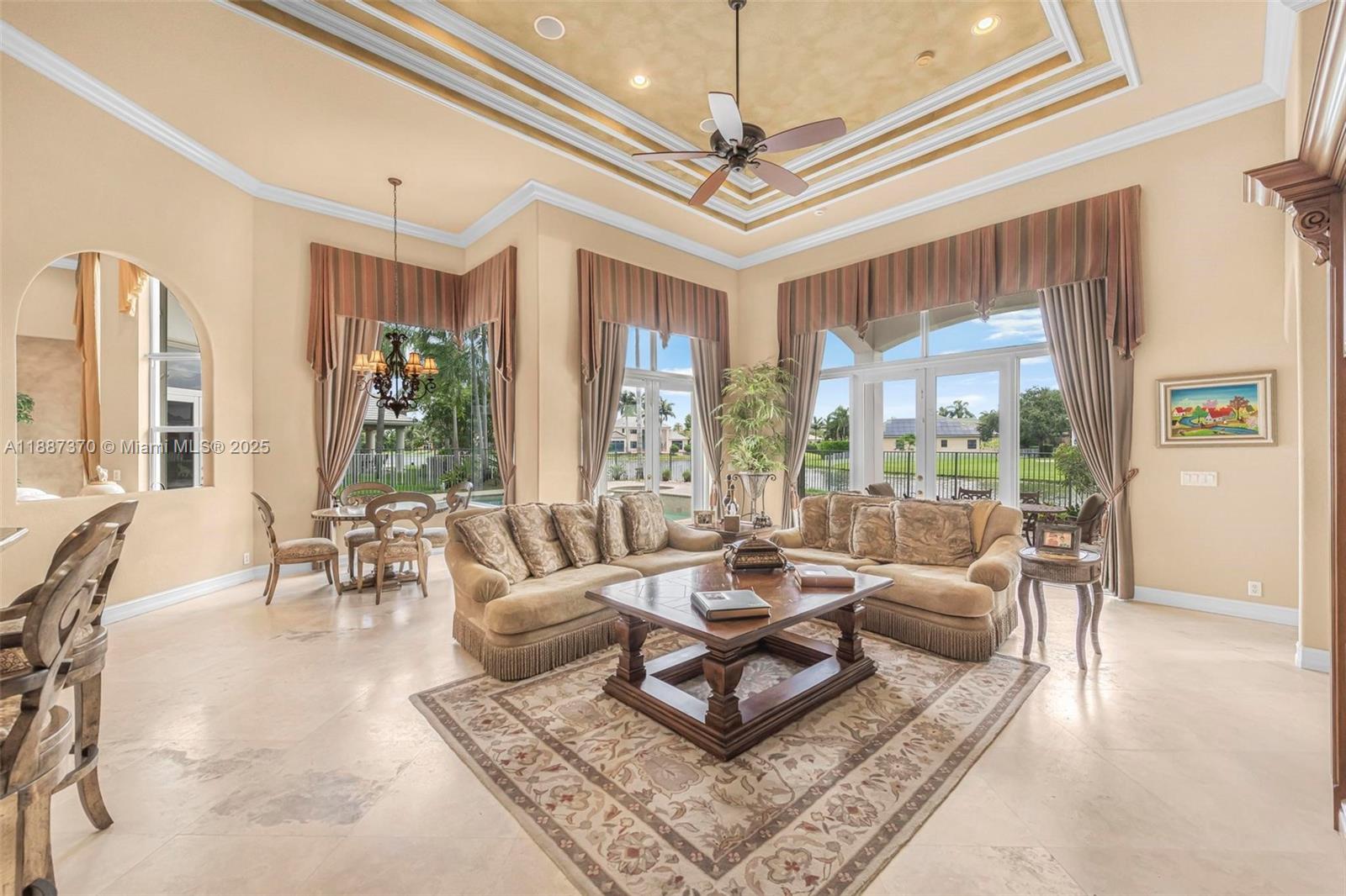 3250 West Stonebrook Circle Davie, FL 33330 - Photo 31 of 73 a living room with furniture and a chandelier