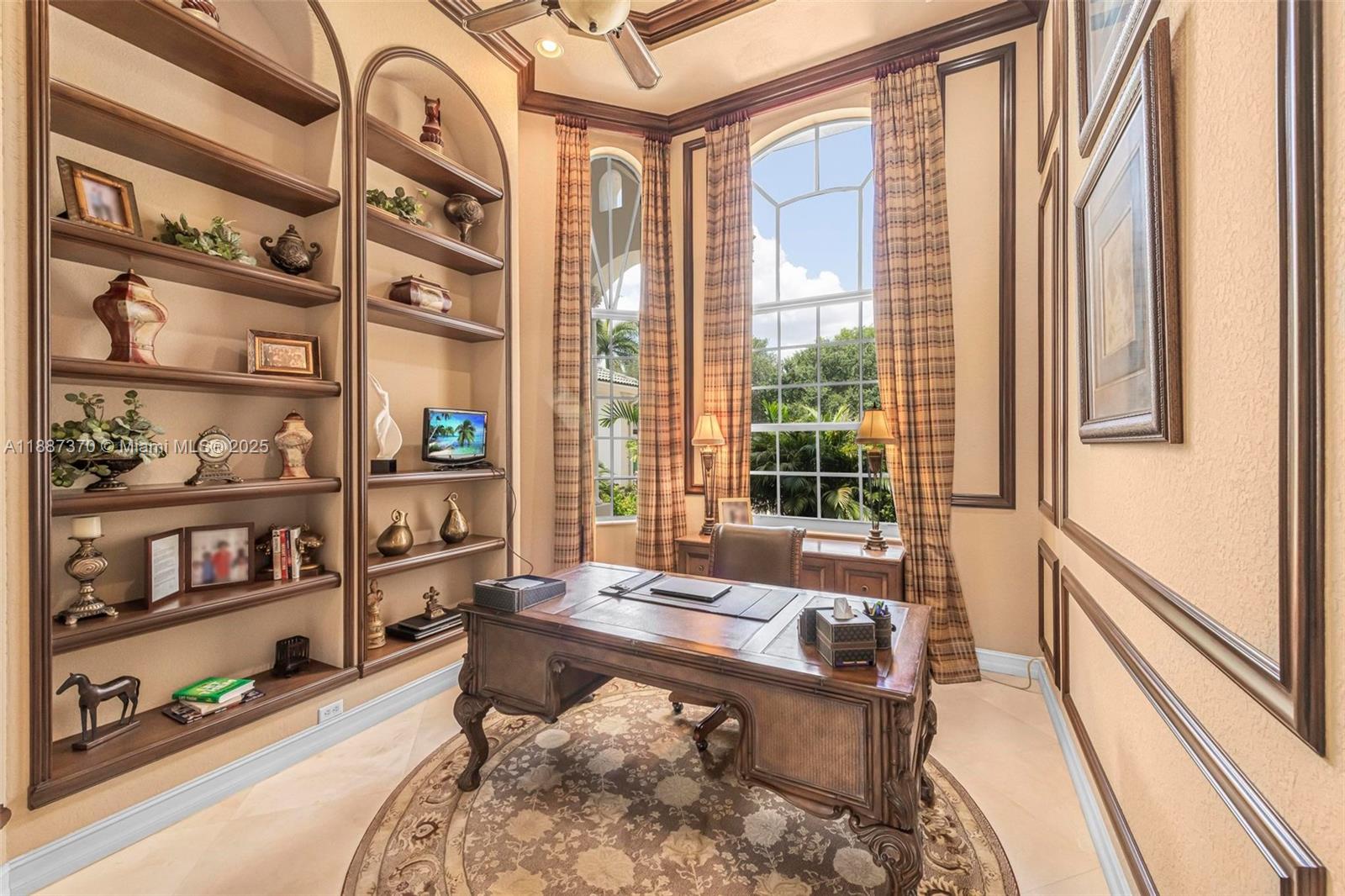 3250 West Stonebrook Circle Davie, FL 33330 - Photo 35 of 73 a living room with furniture and a book shelf