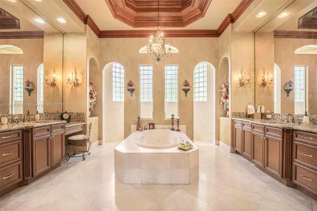 a view of a house with a big yard and palm trees