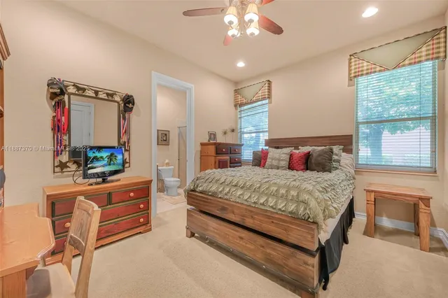 an aerial view of residential house with outdoor space and swimming pool