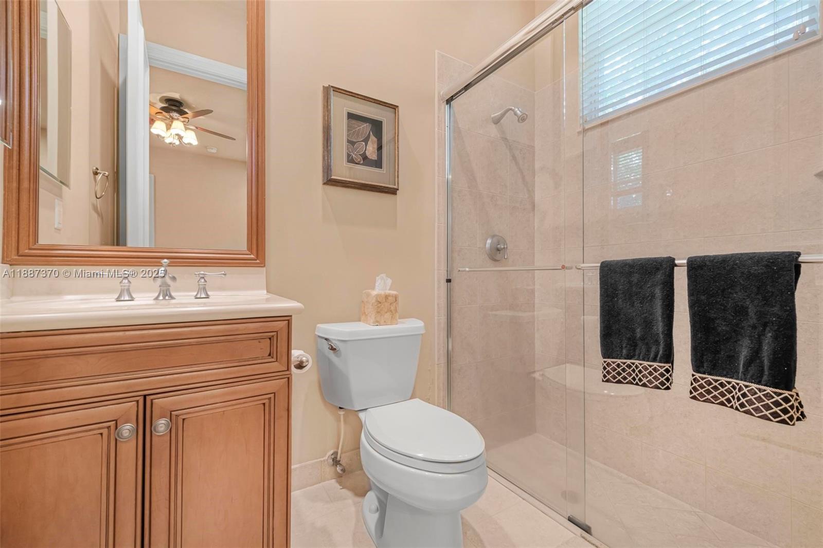 3250 West Stonebrook Circle Davie, FL 33330 - Photo 45 of 73 a bathroom with a sink a toilet and shower