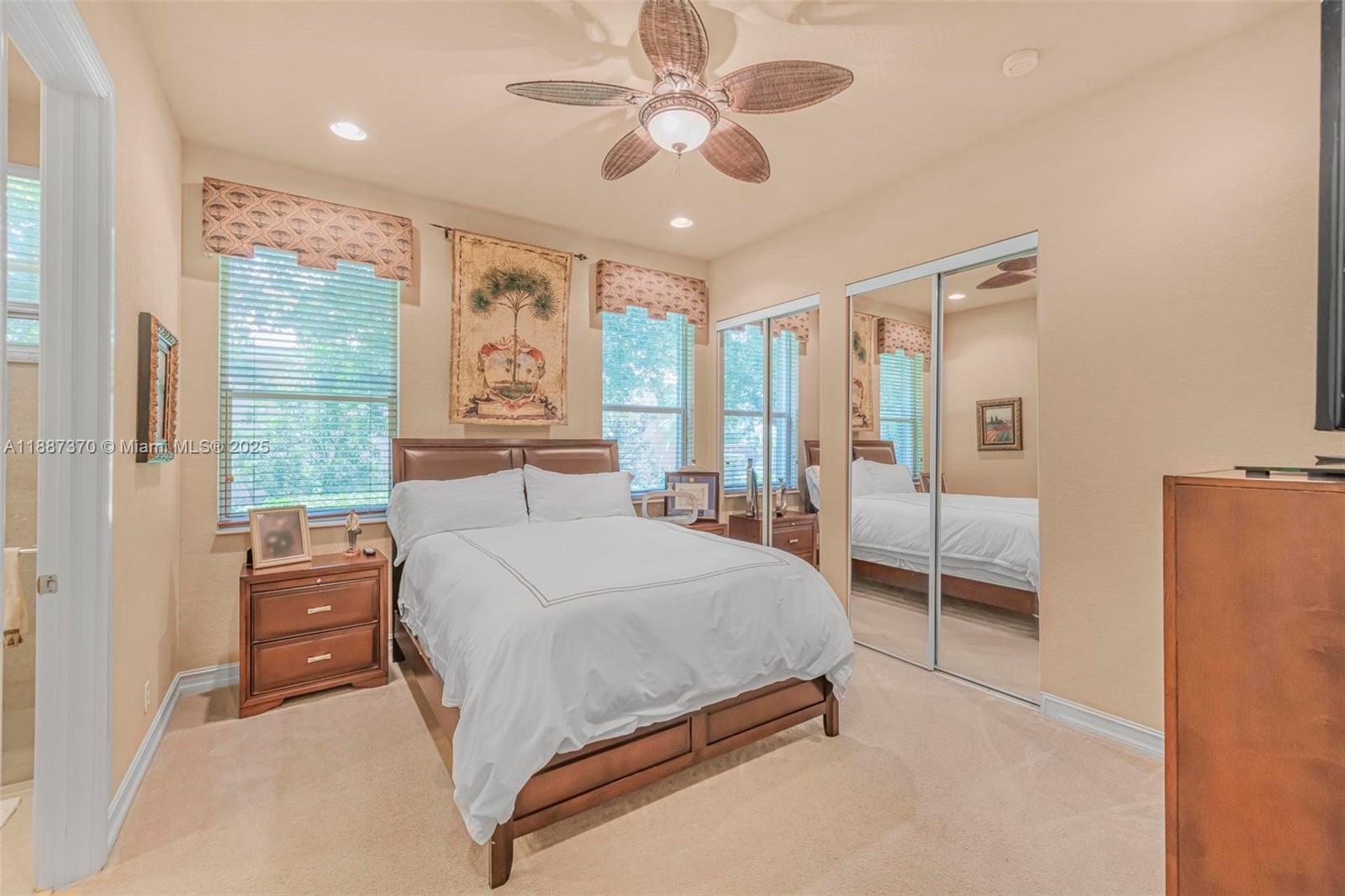 3250 West Stonebrook Circle Davie, FL 33330 - Photo 46 of 73 a bedroom with a large bed and a chandelier