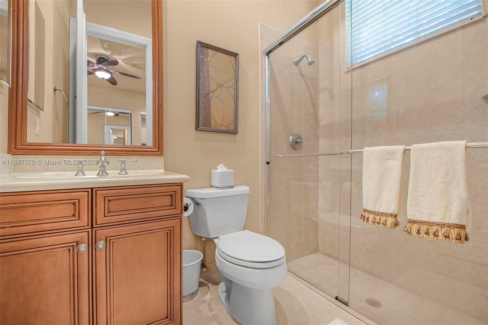 3250 West Stonebrook Circle Davie, FL 33330 - Photo 47 of 73 a bathroom with a sink a toilet and shower