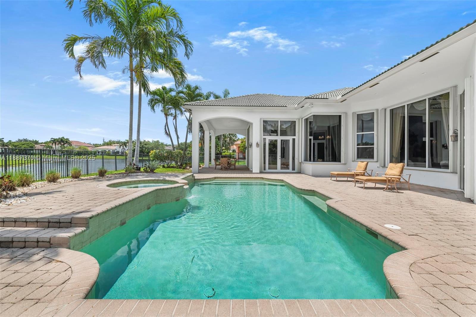 3250 West Stonebrook Circle Davie, FL 33330 - Photo 55 of 73 a view of a house with swimming pool and porch with furniture