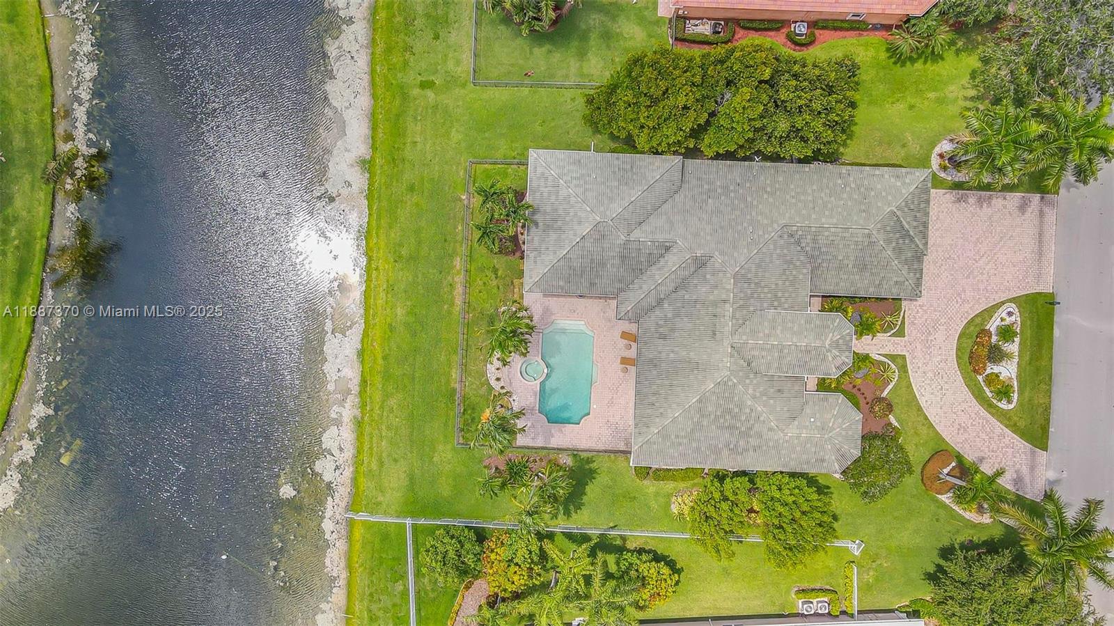 3250 West Stonebrook Circle Davie, FL 33330 - Photo 64 of 73 an aerial view of a house with a yard swimming pool and outdoor seating