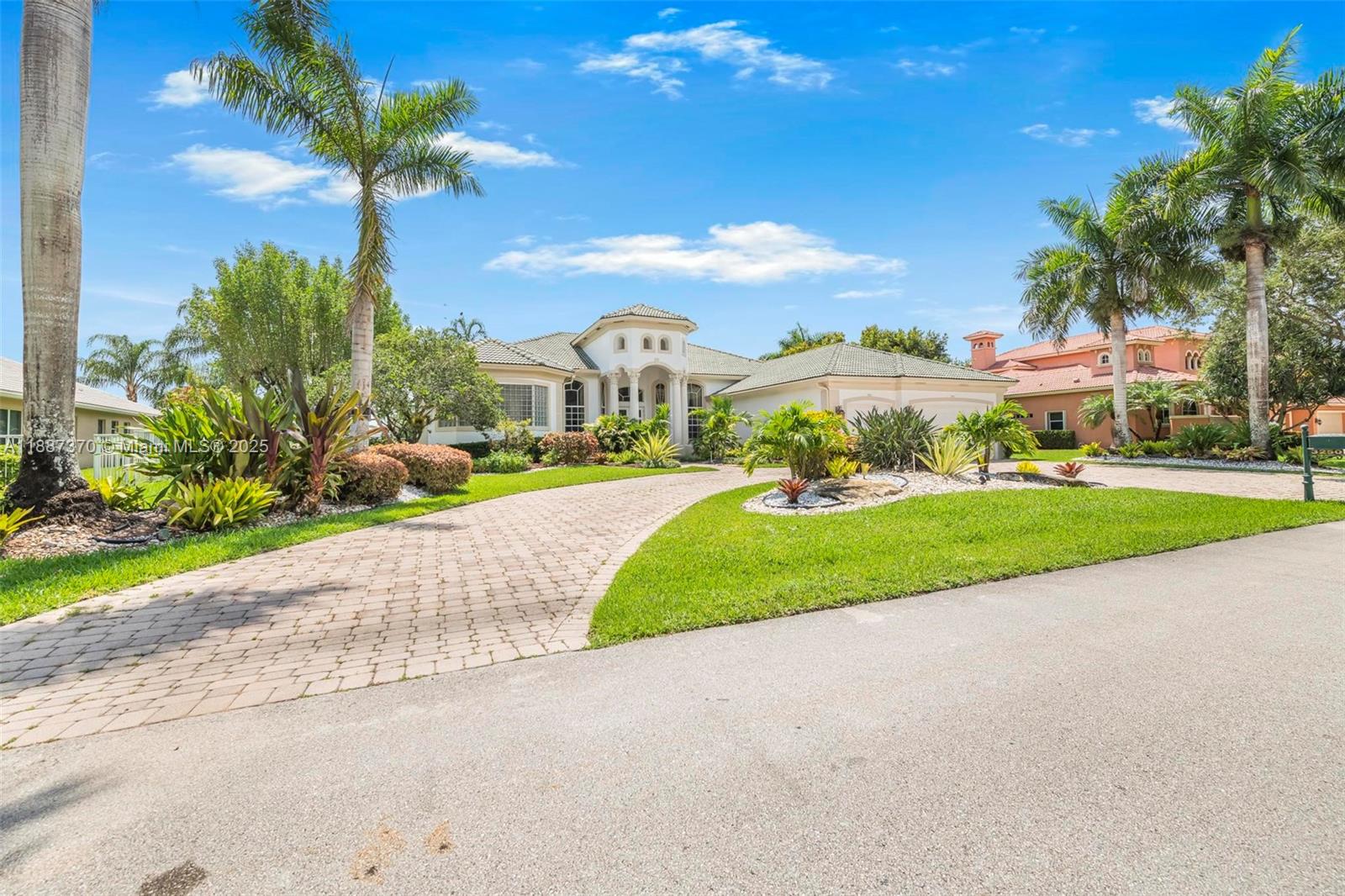3250 West Stonebrook Circle Davie, FL 33330 - Photo 9 of 73 a view of a house with a big yard and palm trees