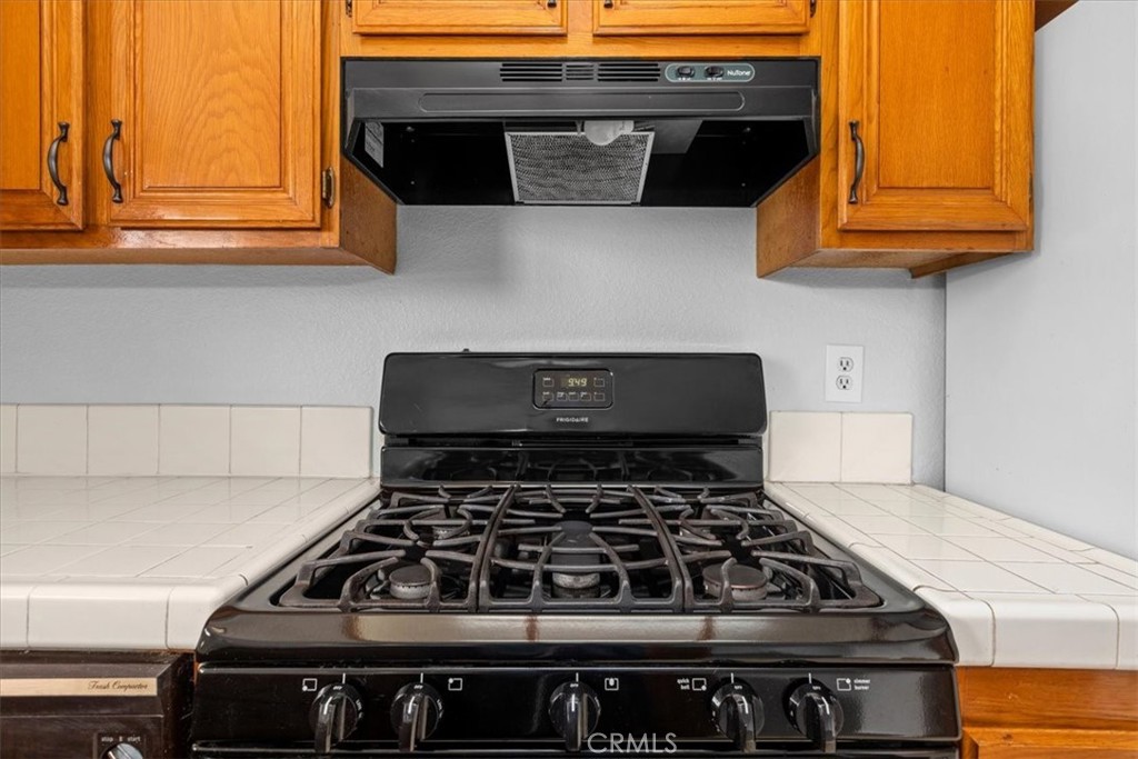 4512 Workman Mill Road, Unit G128 Whittier, CA 90601 - Photo 13 of 26 a kitchen with stove and cabinets