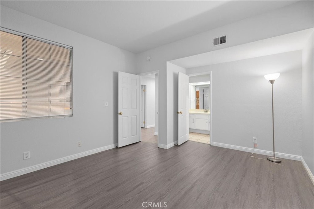 4512 Workman Mill Road, Unit G128 Whittier, CA 90601 - Photo 21 of 26 a view of a room with wooden floor and a window