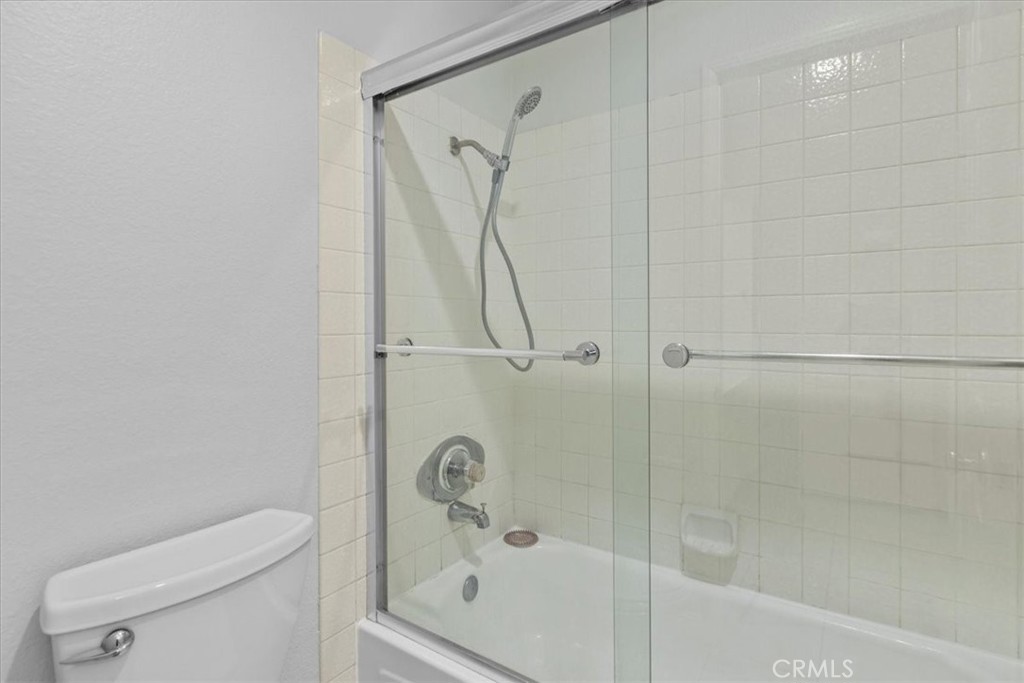 4512 Workman Mill Road, Unit G128 Whittier, CA 90601 - Photo 23 of 26 a bathroom with a shower a toilet and a shower