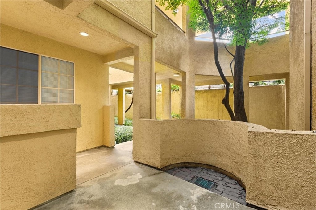 4512 Workman Mill Road, Unit G128 Whittier, CA 90601 - Photo 25 of 26 a bedroom with a bed and a refrigerator