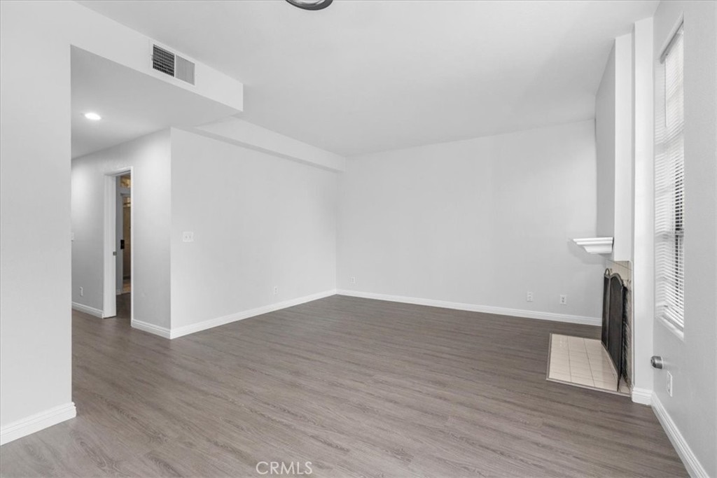 4512 Workman Mill Road, Unit G128 Whittier, CA 90601 - Photo 6 of 26 a view of a hallway with wooden floor