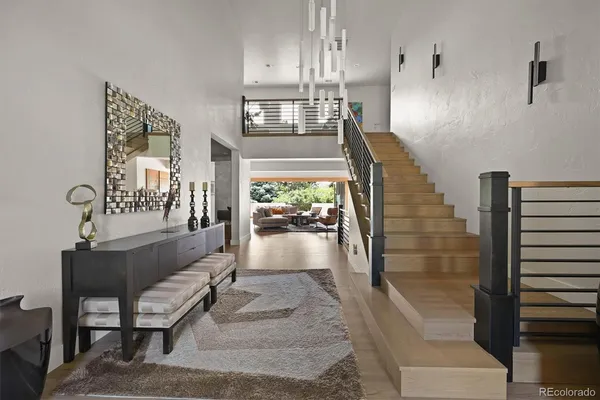 a view of entryway and hall with wooden floor
