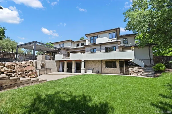 a view of a house with a yard porch and sitting area
