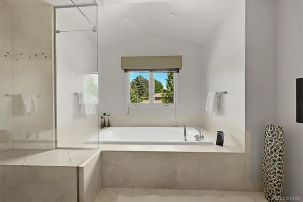 a bathroom with a bathtub and a sink