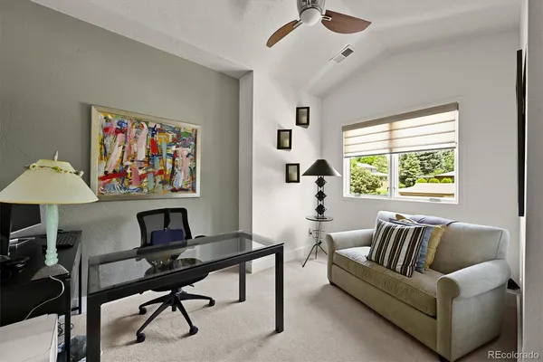 a work room with furniture and a window