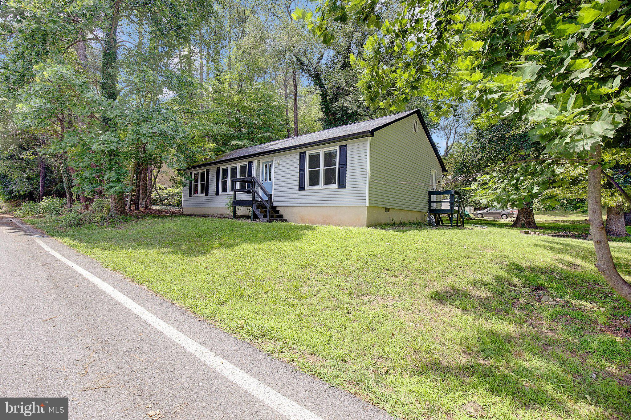 1111 Redeye Road Lusby, MD 20657 - Photo 23 of 24 Charming home nestled in nature's embrace.