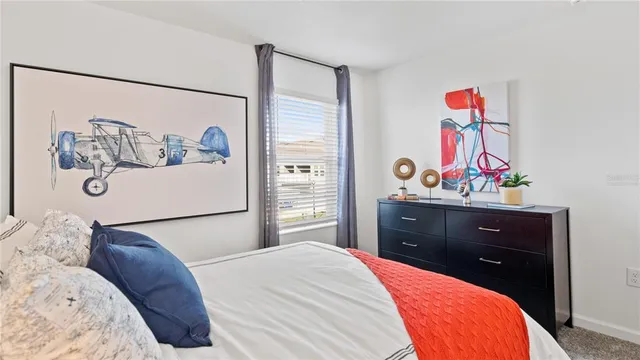 a bedroom with a bed and cabinets