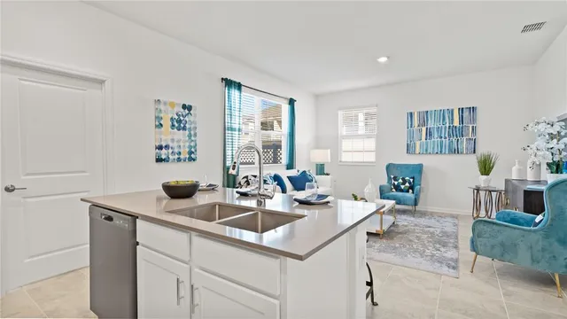 a kitchen with a sink and cabinets