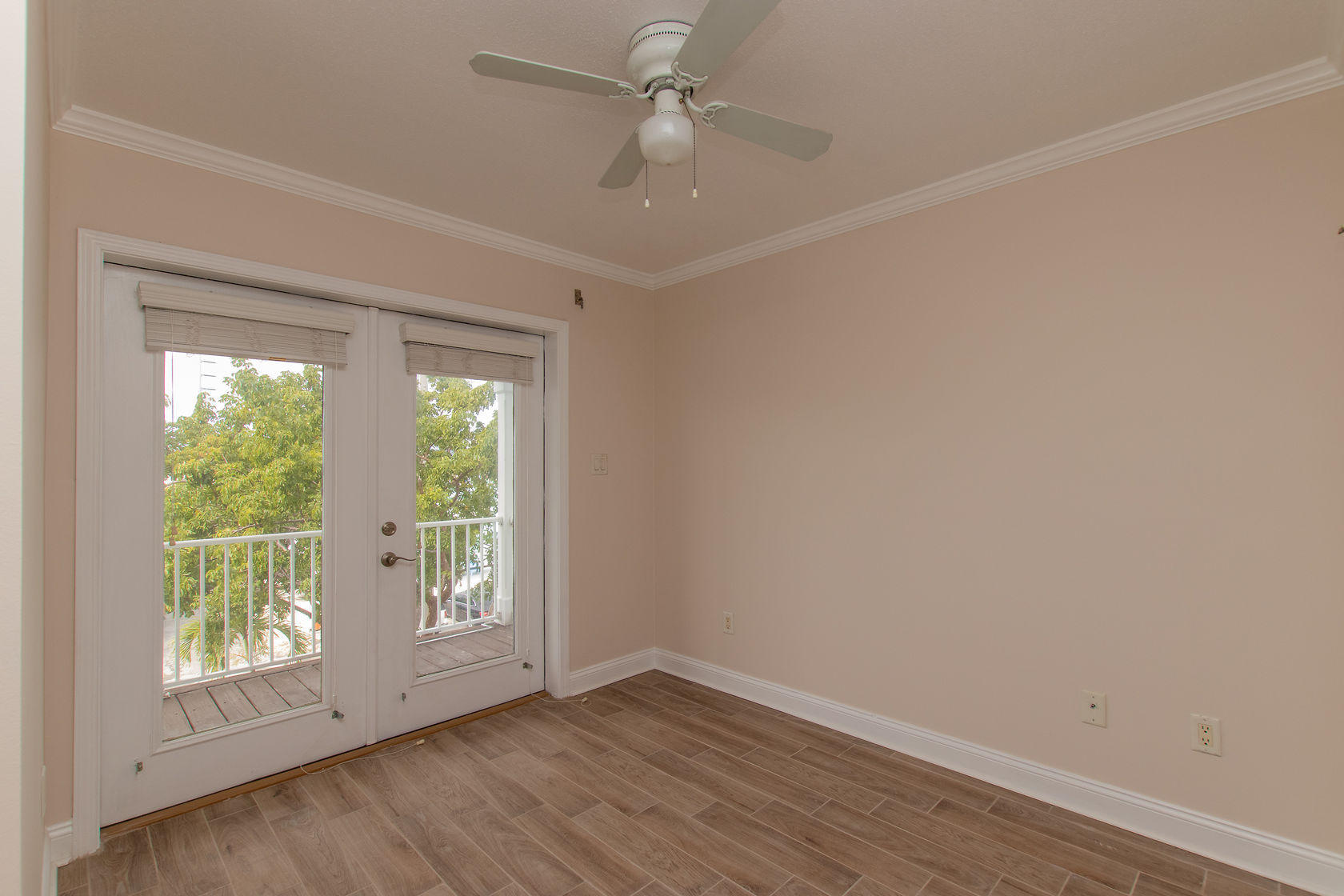 310 24th Marathon, FL 33050 - Photo 20 of 30 an empty room with wooden floor and windows