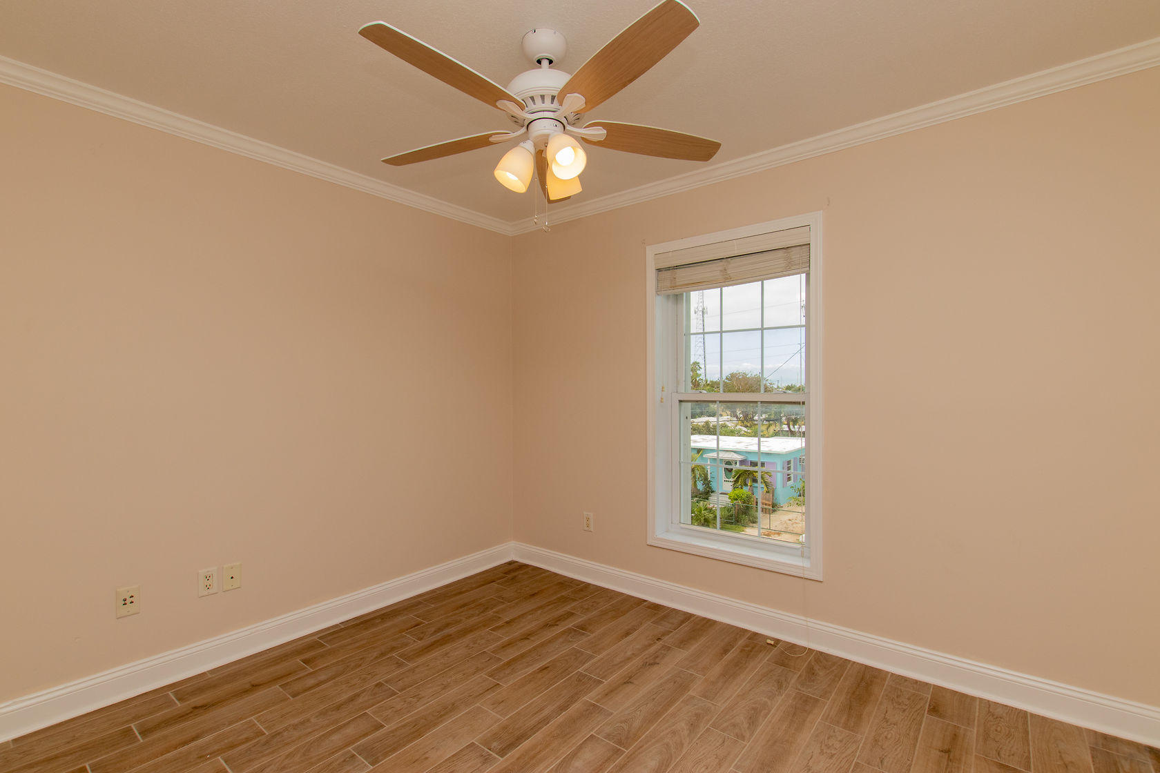 310 24th Marathon, FL 33050 - Photo 26 of 30 an empty room with wooden floor and windows