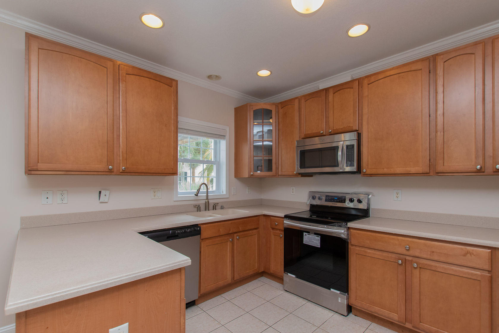 310 24th Marathon, FL 33050 - Photo 5 of 30 a kitchen with stainless steel appliances granite countertop a sink stove and microwave