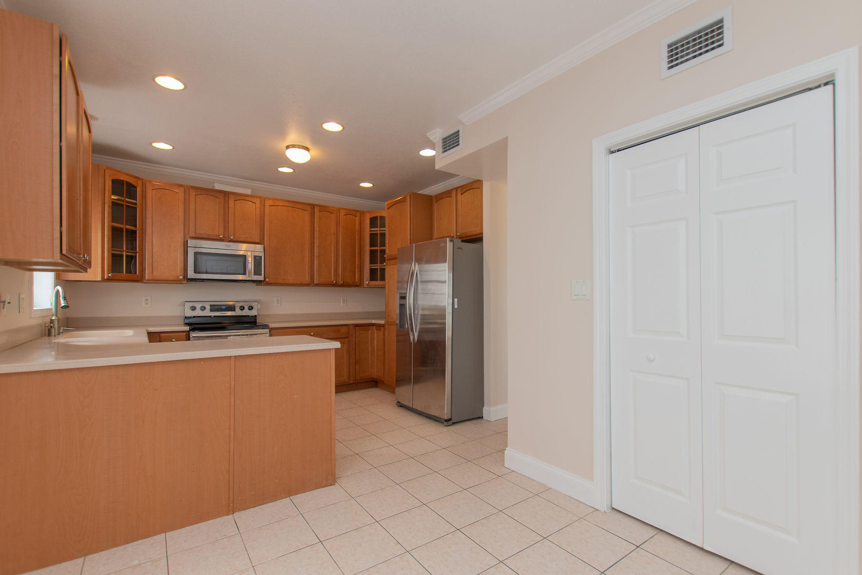 310 24th Marathon, FL 33050 - Photo 10 of 30 a kitchen with stainless steel appliances granite countertop a refrigerator a sink and a stove