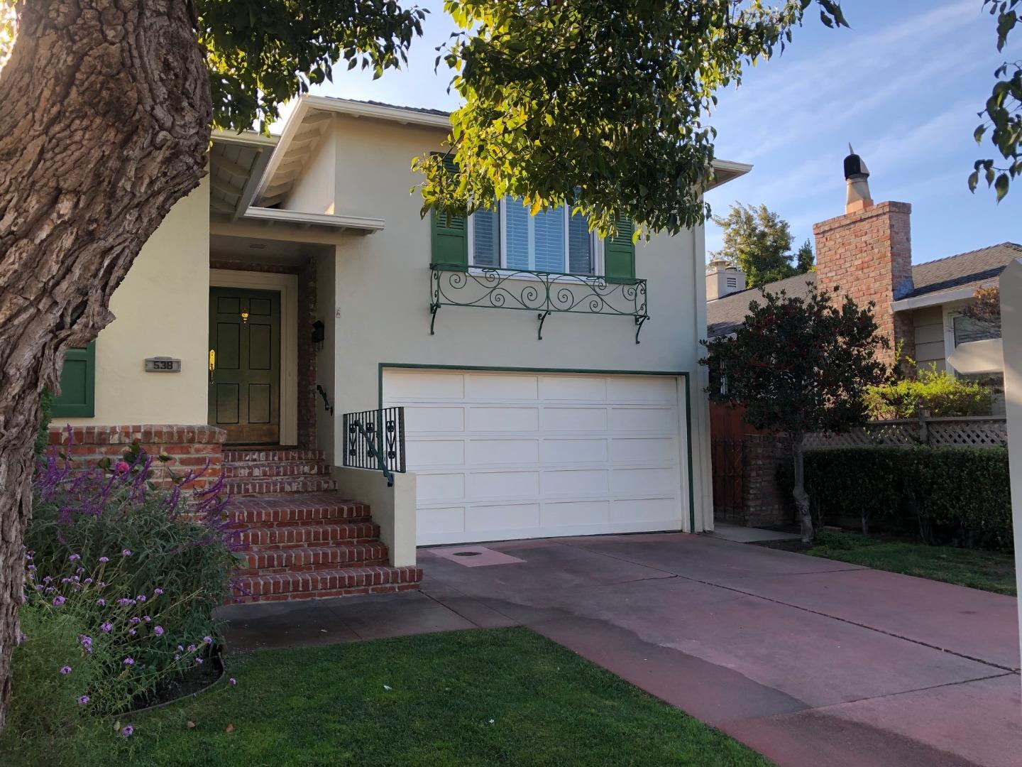 538 Maple Street San Mateo, CA 94402 - Photo 1 of 11 a front view of a house with a garden and trees