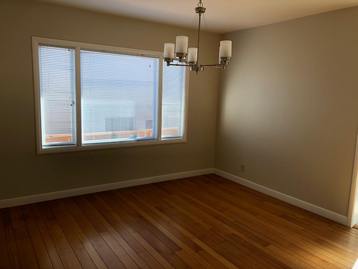 538 Maple Street San Mateo, CA 94402 - Photo 4 of 11 a view of empty room with wooden floor and fan