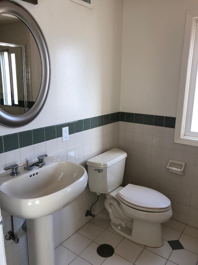 538 Maple Street San Mateo, CA 94402 - Photo 9 of 11 a bathroom with a sink a mirror and a toilet
