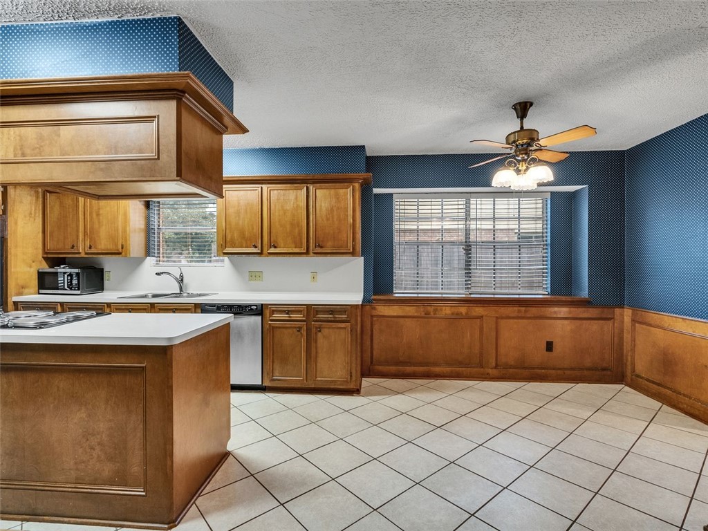 12306 Knobcrest Drive Houston, TX 77070 - Photo 13 of 33 a kitchen with a cabinets and window