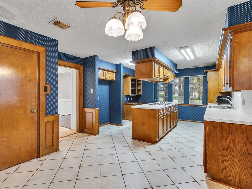 12306 Knobcrest Drive Houston, TX 77070 - Photo 9 of 33 a large kitchen with stainless steel appliances granite countertop a stove a sink dishwasher and a refrigerator